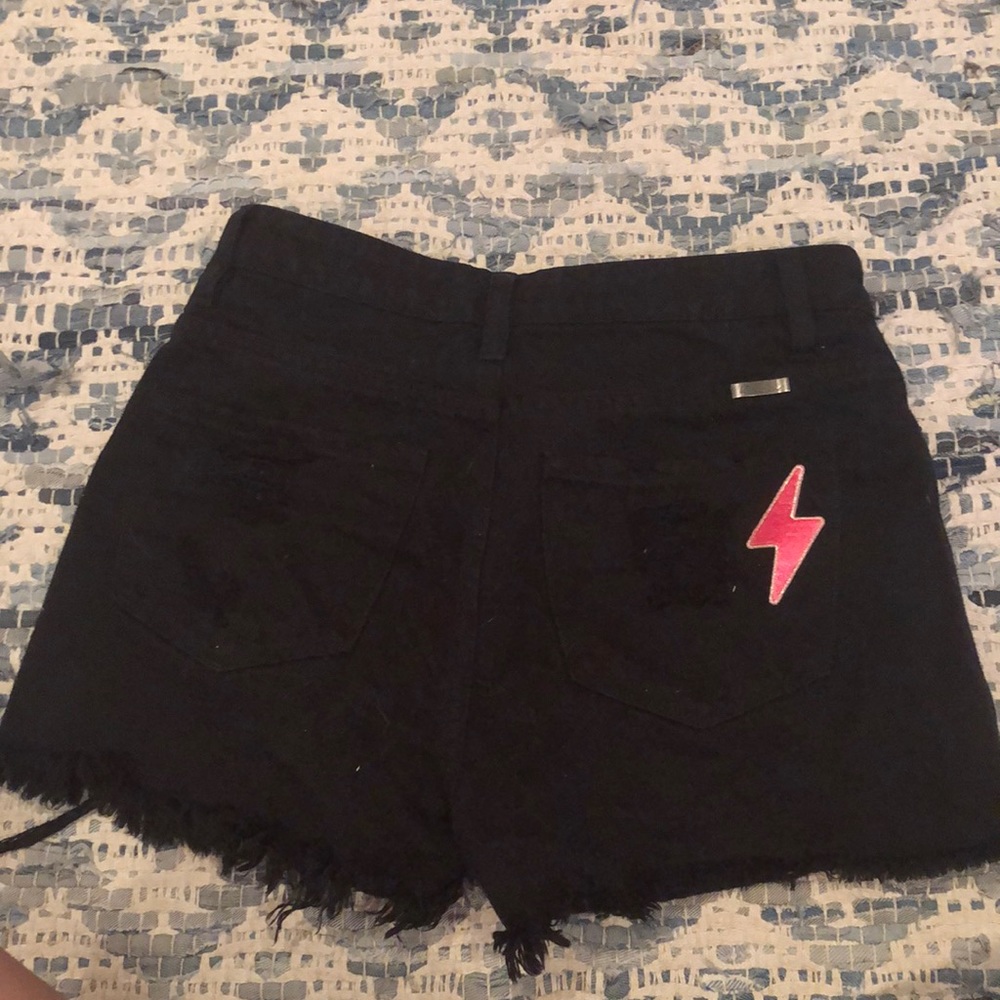 Black jean shorts with lightning bolt patch size small